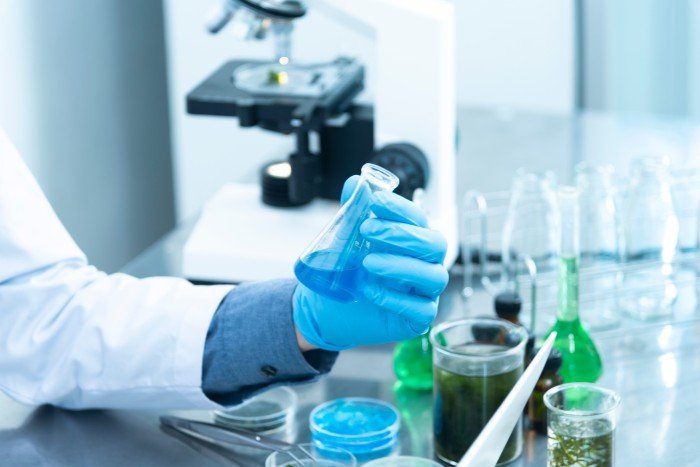 Canva_-_Person_Holding_Laboratory_Flask.jpg